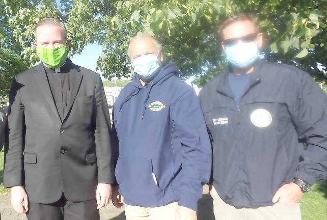 Pictured from left to right: The Rev. David Rider, the administrator of Sacred Heart Church; Monroe Town Supervisor Tony Cardone and Orange County Executive Steve Neuhaus. Rider said he wanted to be a peaceful presence of support. Neuhaus said: The policeman would not have been charged with murder without 1) body cams and 2) protests. It's clear as day. The only thing we can do is learn from this.