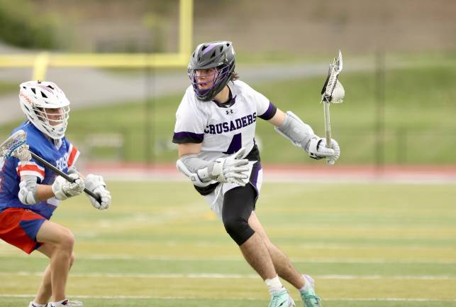 Ryan Behringer #4, works past a gladiator defender