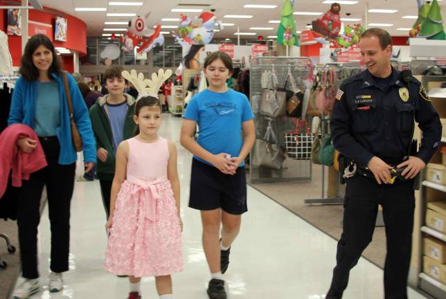 Your mission, should you choose to accept it, is to pick out cool toys: Police Office Christopher Caruso with Katherine, Albert and Alex.