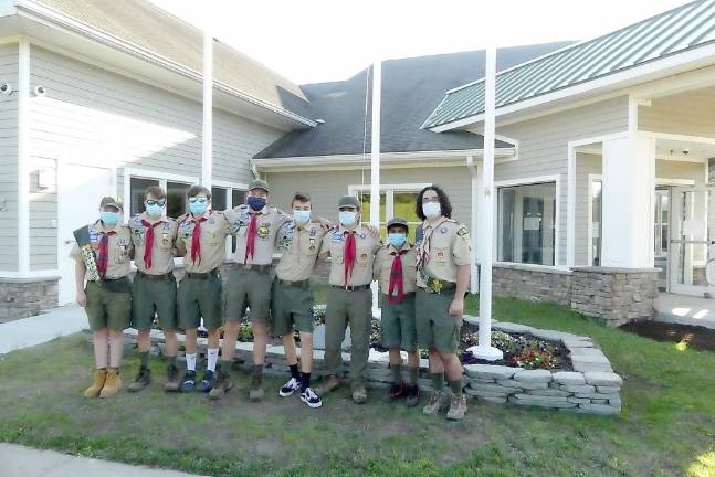 A.J. Roberts with fellow members of Troop 440 who assisted in the successful completion of his Eagle Scout project - the installation of a triple flagpole at Monroe Town Hall.