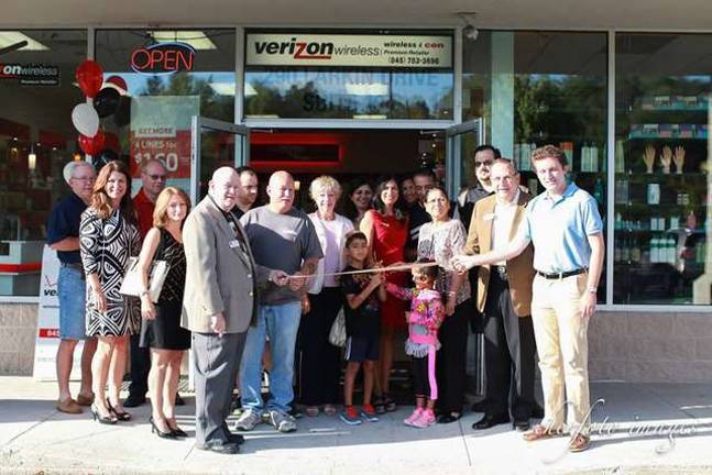 Photo provided Members of the Monroe and Woodbury chambers of commerce joined owner Nini Kaur in a ribbon cutting celebrating the 10th anniversary of the Wireless Icon Verizon Wireless store on Larkin Drive.