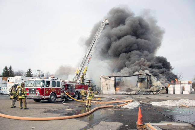Photo by Robert G. Breese On the scene Thursday of the fire that destroyed the Mid-State Lumber warehouse on Kings Highway.