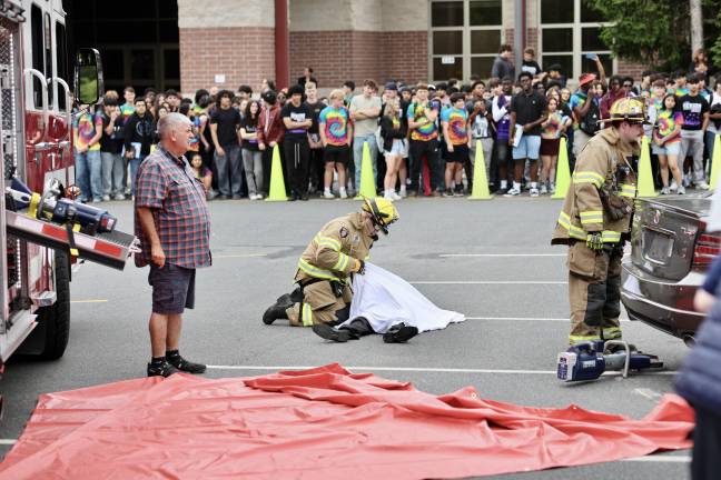 A fireman pulls the sheet over the deceased victim during the Mock Accident on June 16, 2025.