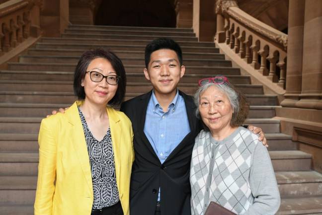 Monroe Woodbury High School valedictorian Alex Liu with his mother Yuwei Xu, left, and grandmother.