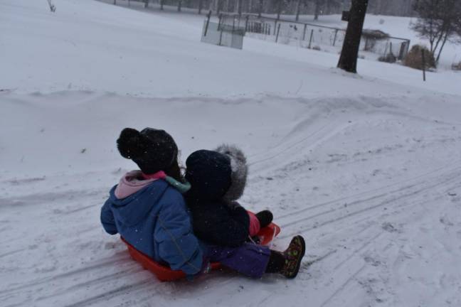 Kai and Juno Gara, 8 and 5, sledding in Pike County Pa. (Photo provided)