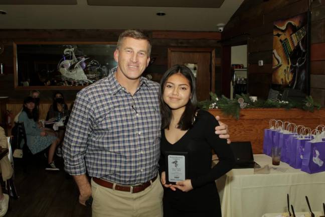 Head Coach Christopher Goodwin gives Kendra Contreras the Most Improved Player Award