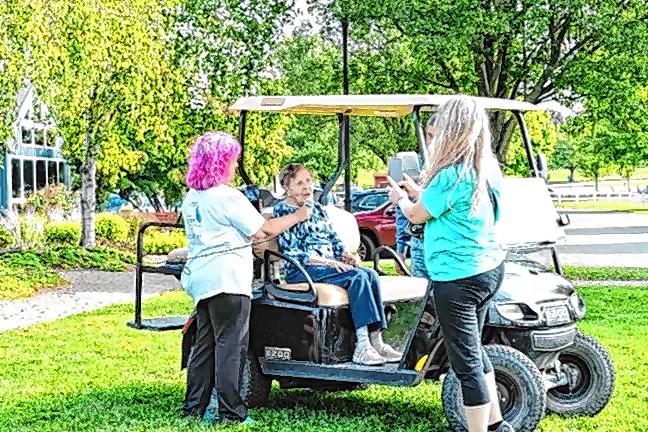 <b>Julia Quinlan, 97, speaks to the participants at the Celebrate A Life 5K Walk last September. (File photo by Maria Kovic)</b>