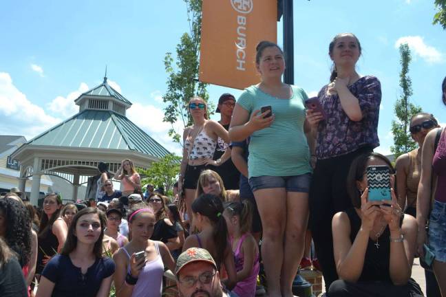 Fans look toward the pathway where Nick Jonas and Demi Lovato would be walking from.