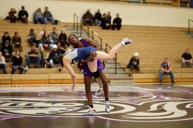 Devin Charles records a late take down in his match at 124 lbs.