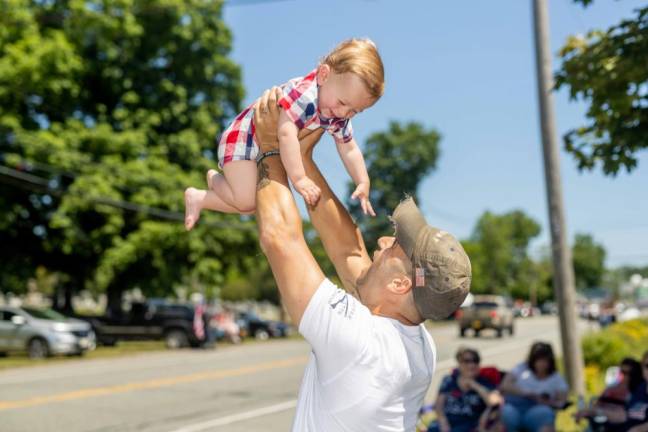 Luke, 11 months, and his dad at the Monroe Memorial Day Parade.