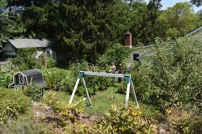 Visitors tour the garden of Ozzie Colon and Lauren Mariotti in Warwick, N.Y. (Photo by Becca Tucker)