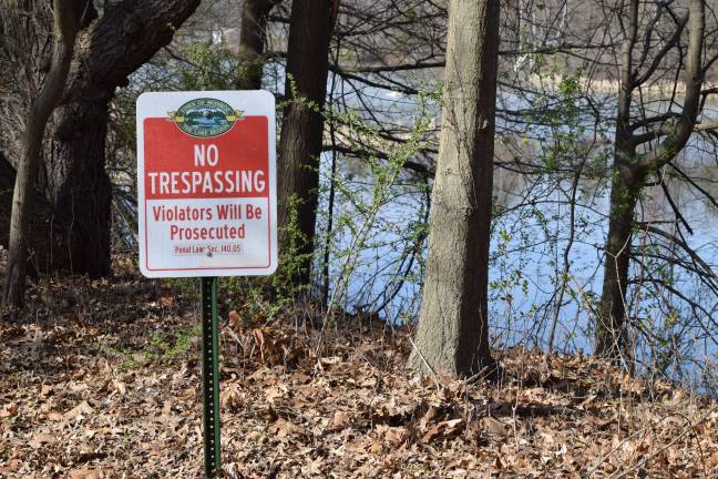 Photo by Erika Norton Two new "no trespassing signs" are now near the marshy area where two swans have made their nest, after a resident reported that the nest was likely vandalized.