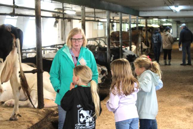 Children listening and learning at CCE’s Open House on the Farm.