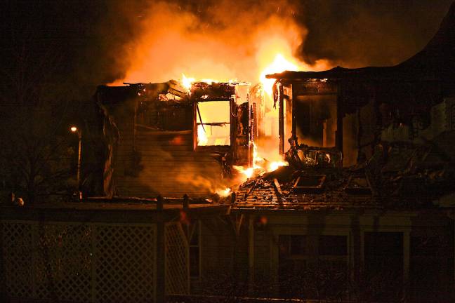 Photo by Douglas Peifer Firefighters were on the scene of a house fire on Darra Court in Monroe from 10:20 p.m. Saturday until 4:30 a.m. Sunday morning.