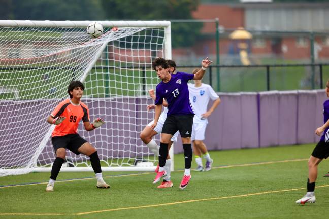 Zachary Seltzer out battles the Viking defense for the ball after a corner kick.