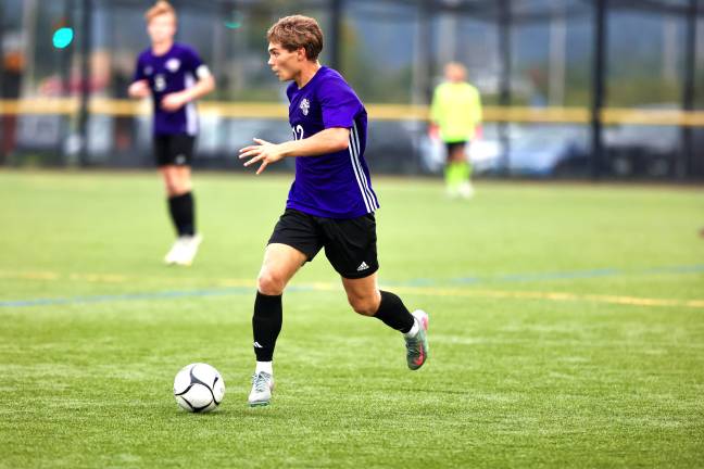 #12, Pedro Pizzoferrato moves the ball down the sideline.