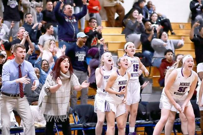 The Crusader bench and fans erupt after Olivia Shippee steals and scores in the fourth quarter.