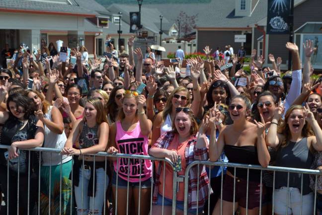 An eager crowd gets excited for Nick Jonas and Demi Lovato.