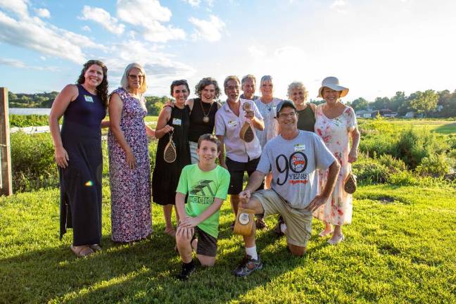 The 2023 Kitchen Garden Tour winners. Back row, left to right: Megan Curry, April Perciballi, Aysha Venjara, Dirt Editor and Publisher Becca Tucker, Common Ground Community Garden’s Chad Pilieri, Bob Linguanti, Kathy Linguanti, Straus News Publisher Jeanne Straus, Apple Acres Community Garden’s Thornton. Front row: Perciballi’s grandson Aidan and Patrick Moynihan. Photo by Aja Brandt