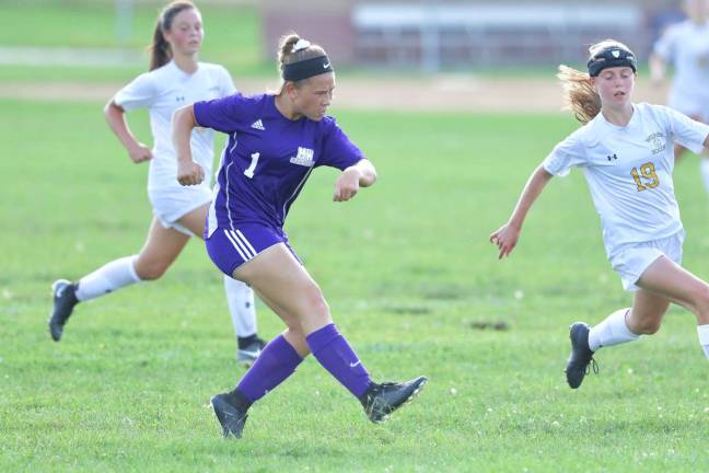 Photo by William Dimmit Kaelyn Salato (#1) pounds this shot off the Wizards goalie&#x2019;s hands for the first goal of the game.