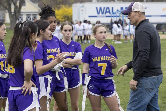 Warwick Valley coach Rocco Manno talks to his girls’ flag football team during a 2024 game against Middletown. (Photo provided by the Warwick Valley School District)