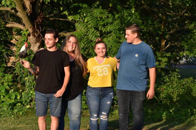 The Gidneys, from left: Eric the rooster, Johnny, Laura, Maggie and Zack at Stanley-Deming Park in Warwick on July 22.