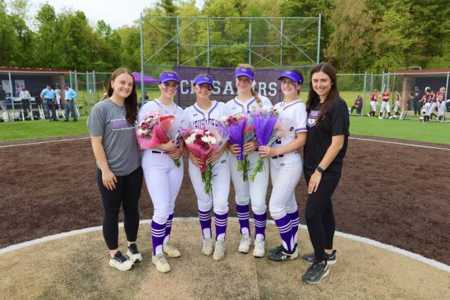 The seniors on the team were honored with flowers. L-R: Assistant coach Jordan Earl, Carly Olsen, Allyson Havercamp, Val Pederson, Erin Coyle, and head coach Taylor Sullivan.