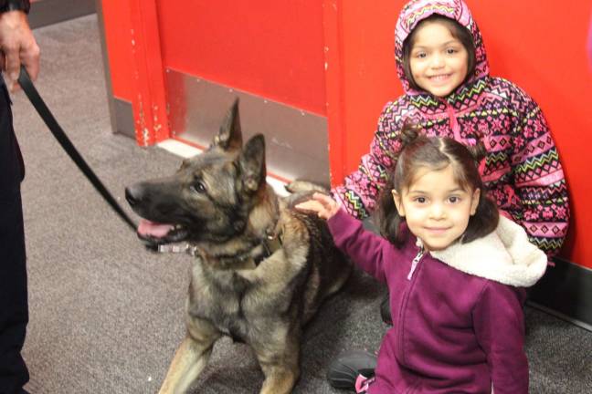 Woodbury K-9 Zeke with Yoselyn and Devora Sosa.