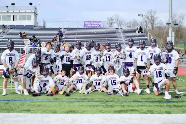 The 2024 Crusaders celebrate their opening day 14-7 victory over Wallkill.