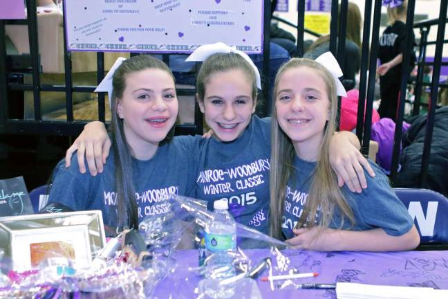 Modified cheerleaders Sophia Bendix, Carolann Adipietro and Caitlin Reynolds were helping to sell raffle tickets for Varsity&#xfe;&#xc4;&#xf4;s trip to Nationals.