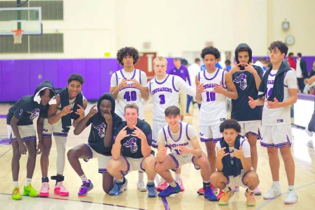 The Crusaders celebrate their 59-44 opening day victory.