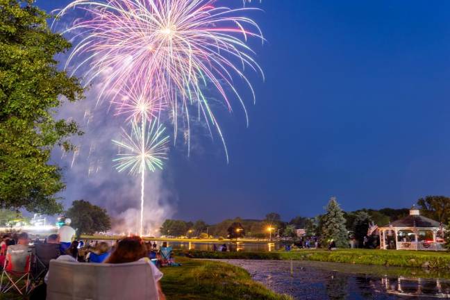 As the sun set and the crowd waited for the show to start - people danced along to the band. When the music ended, cheering erupted as the first fireworks illuminated the sky with brilliant colors.