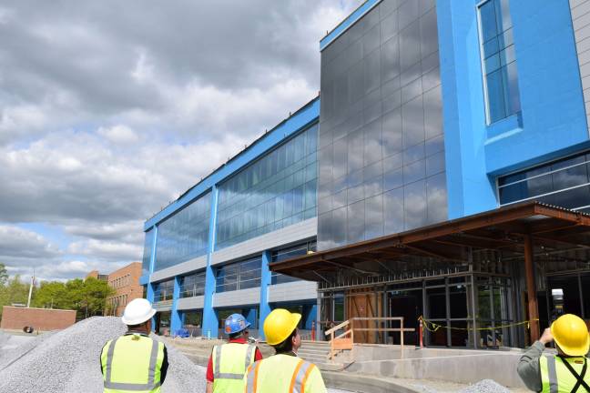 Photo by Erika Norton Orange County officials lead media on a hard-hat tour of the new government center in Goshen on May 12.
