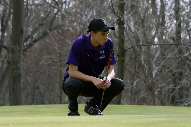 Photos by William Dimmit Matt Hogan studies his shot on the seventh green; he carded a 43 on the afternoon.
