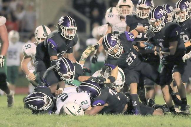 The Monroe-Woodbury defense kept the Crusaders in the game by creating four turnovers.