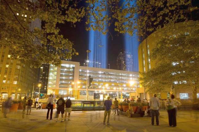 Towers of light mark the Manhattan sky. Photo by Robert G. Breese.