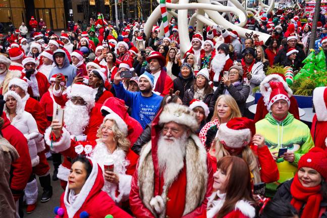SantaCon attendees in New York City on Saturday, Dec. 13, 2025. (AP Photo/Ryan Murphy)