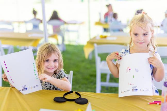 Evelyn and Aubrie, 4, make letters for children in local hospitals at Hope Rocks for Kids benefit at Smith’s Clove Park. Photos by Sammie Finch