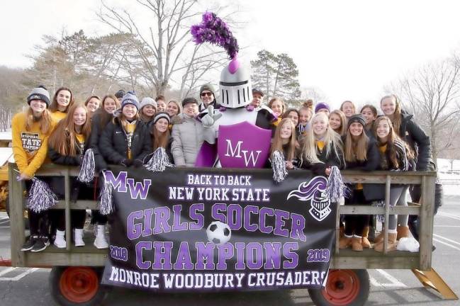 The end of the line: the Crusaders celebrate with Monroe officials in Smith's Clove Park.