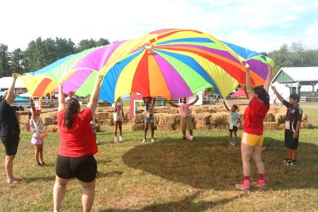 ”All Aboard to the Fair!” participants take part in a wellness activity at the Country Fair.