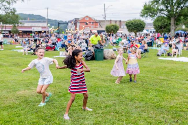 The Georgia 5 Band kicked off the party as vendors and food trucks lined Lake Street prior to the display, with many people, including these four young girls dancing as only young girls can dance.