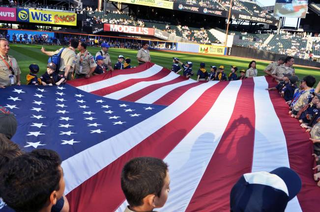 The flag was heavy but ably managed by the scouts.