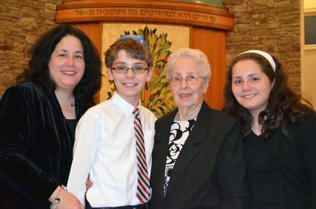 Photos by Abby Wolf Pictured from left to right are: Karen Pomerantz, son David, her mother Reni Schustermann and her daughter Rebecca Pomerantz at the Yom HaShoah commemoration at Eitz Chaim Monroe.