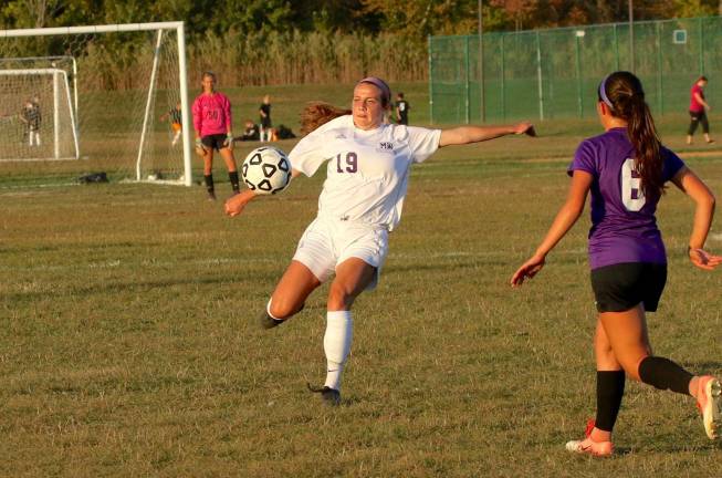Nicole Conway (#19) keeps the ball in the Wildcats zone in overtime.