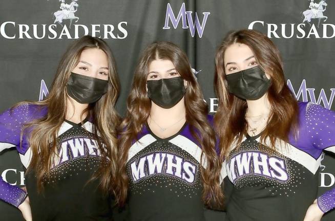 The new look of Monroe-Woodbury Cheer: Senior cheerleaders Naya Flores, Gina Pirraglia and Hayley Proscia.