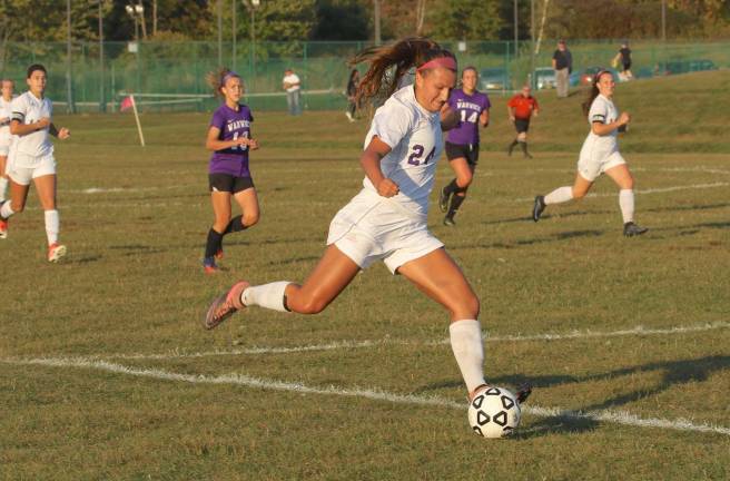Senior Caroline Helbeck (#24) gets off a shot late in the game.