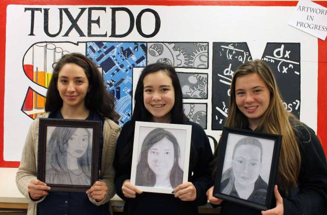 Provided photos George F. Baker High School students Laila Isa, left, Katiana Arcuni and Leann Kearney hold their self-portraits. These students are in photography as well as drawing and painting classes. In drawing and painting class, they have created one- and two-point perspective artwork, acrylic paintings, oil pastels, animals crafted from recycled products and these self-portraits.