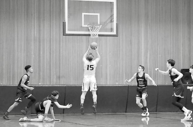 Sometimes you just get lucky: This Eagle player gets off his last second shot as the Crusader defender slips.