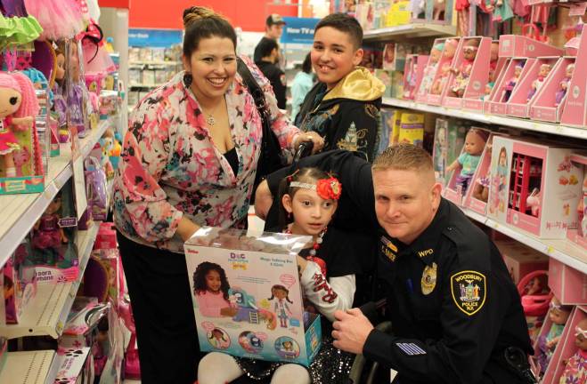 Angelina Khristy and her mom picking out toys with Det. Michael Bauer.