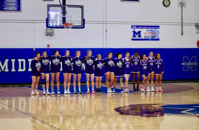 The Crusaders line up for the National Anthem before their playoff game on Tuesday.